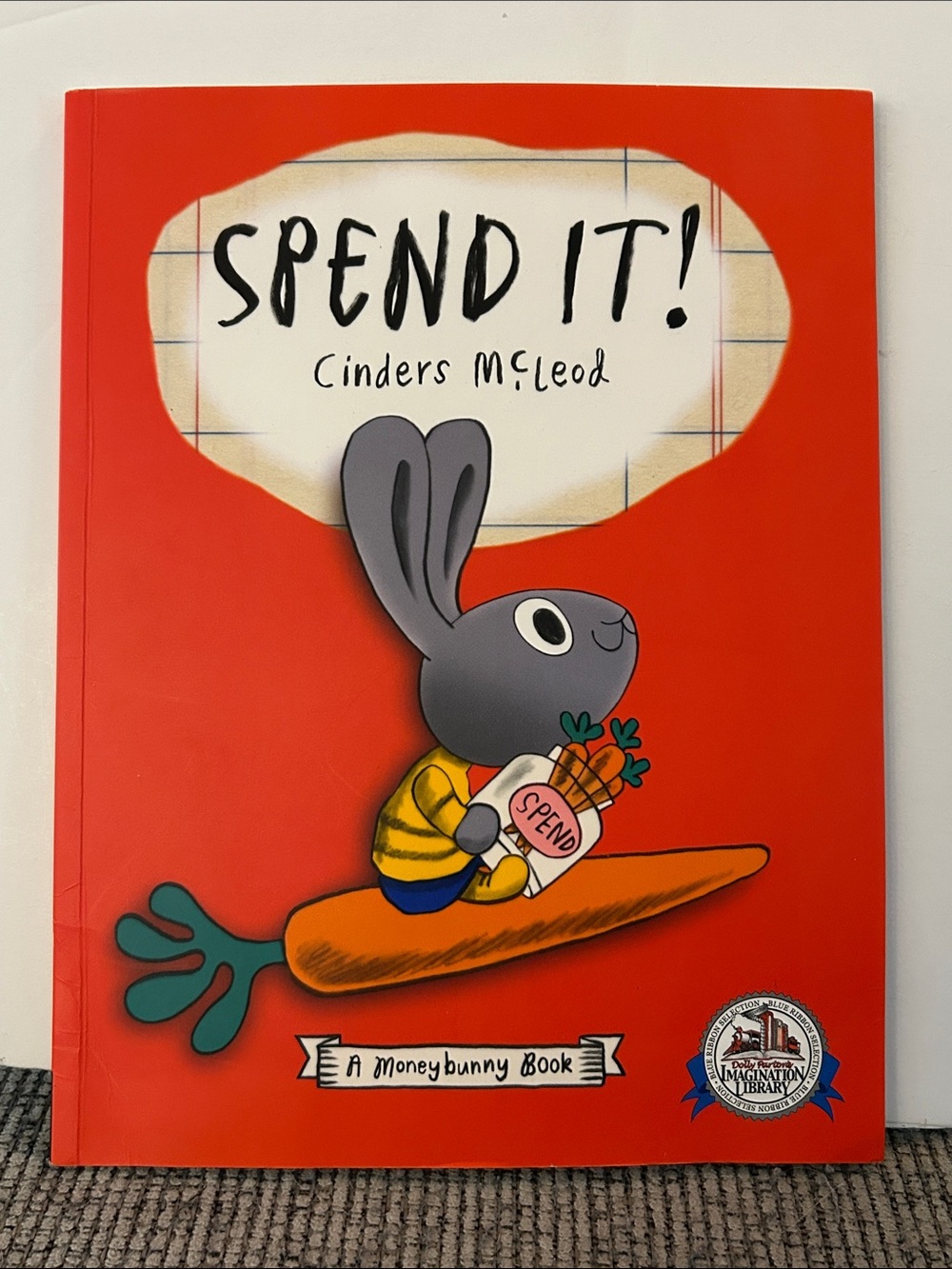 children's paperback picture book Spend It! by Cinders McLeod a money bunny book